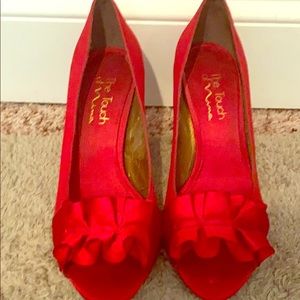 Red open toe pumps